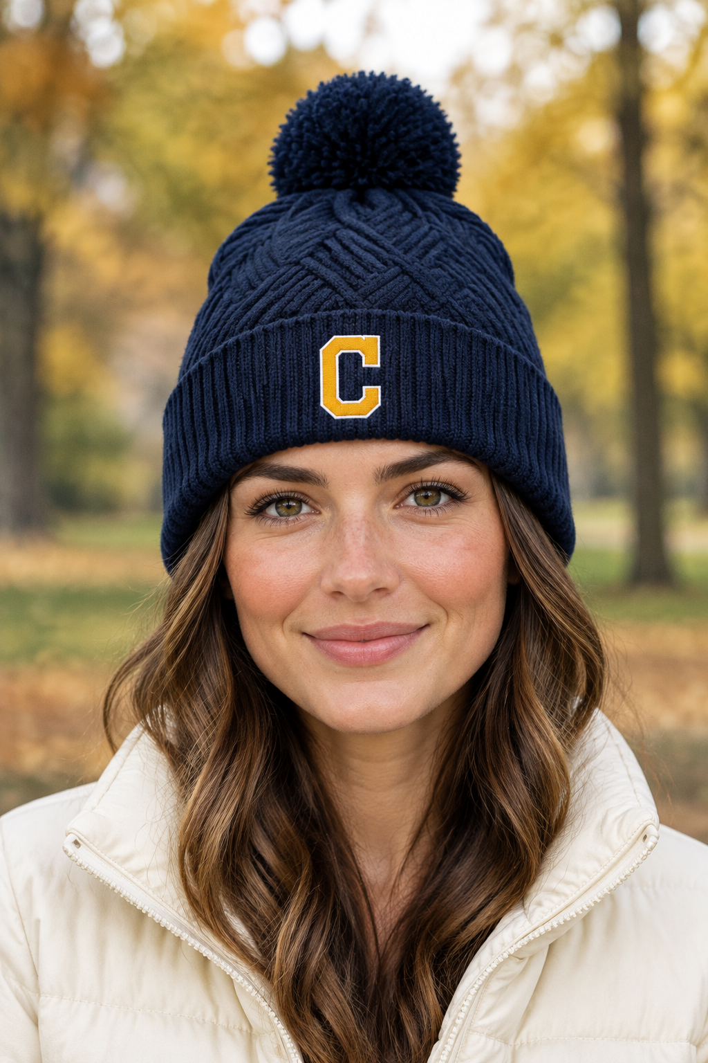 Woman outdoors wearing the navy C-logo beanie